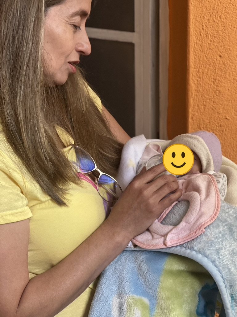 Caring for one of the youngest children at Hogar Luz de María